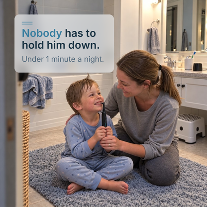 A toddler in pajamas holds the STRYN handle while his mom steers, at bedtime on the bathroom mat.
