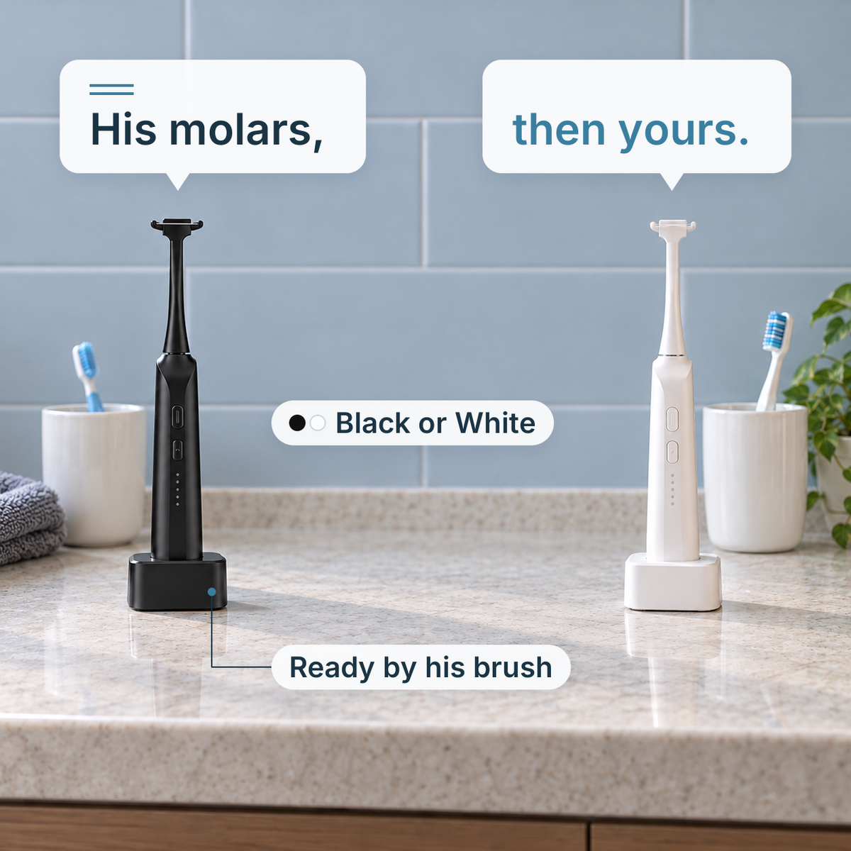 Black and white STRYN on their charging bases, one by a child's toothbrush and one by an adult's.